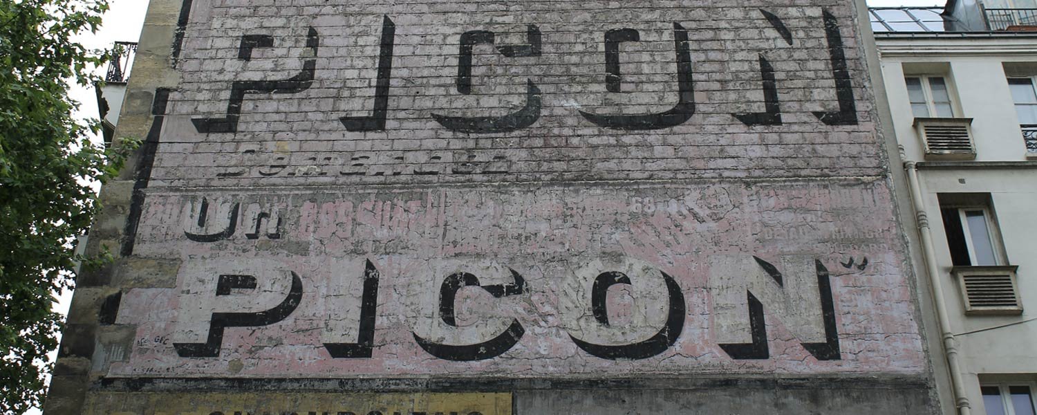 Détail du vestige La réclame peinte Amer Picon de la rue Collette